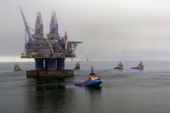 The Hibernia offshore oil production platform being towed to the oil fields 315km from St. John's on the Grand Banks of Newfoundland.
Photo by Greg Locke (C) 2006 www.greglocke.com
Film scan